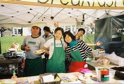 volunteer at farmers' market in Oakland